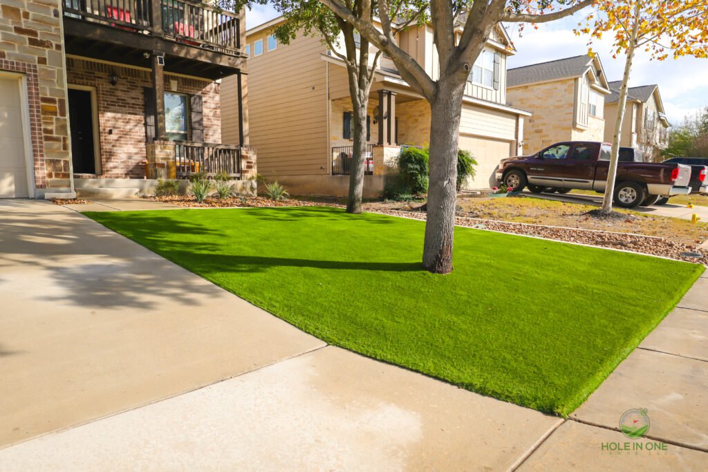 Synthetic turf putting green in landscaped yard