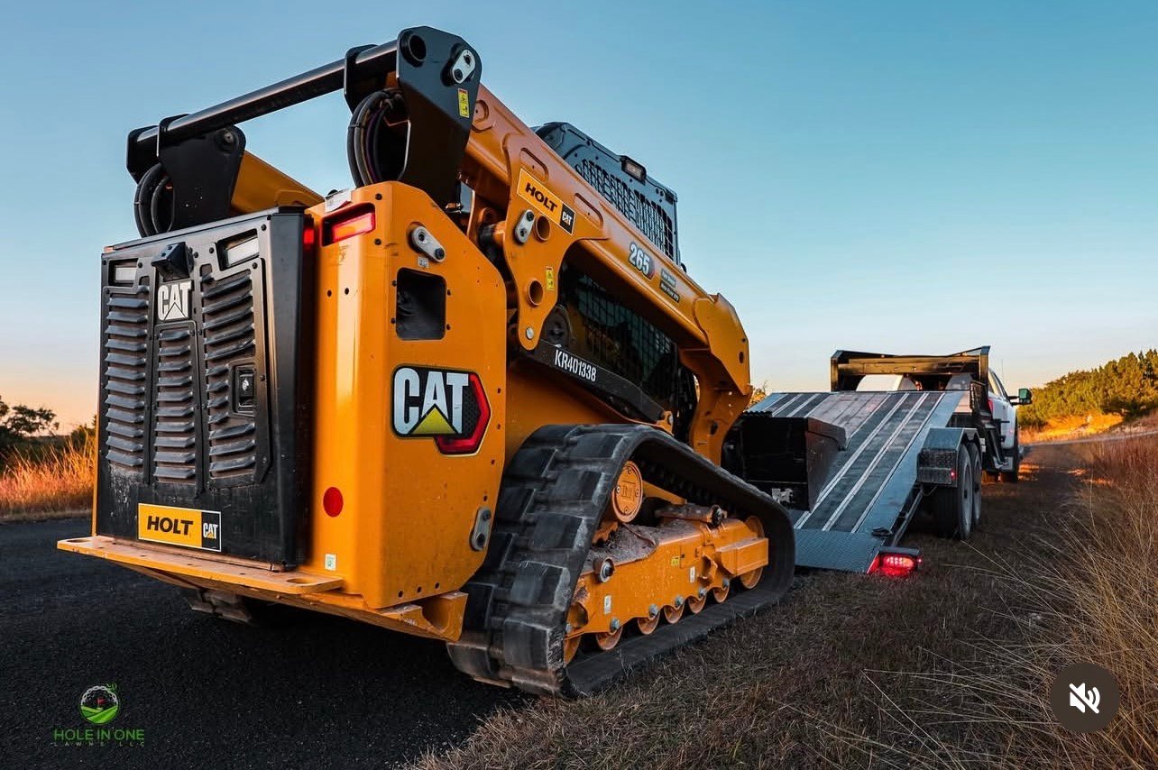 CAT compact track loader grading a residential landscape project in San Antonio
