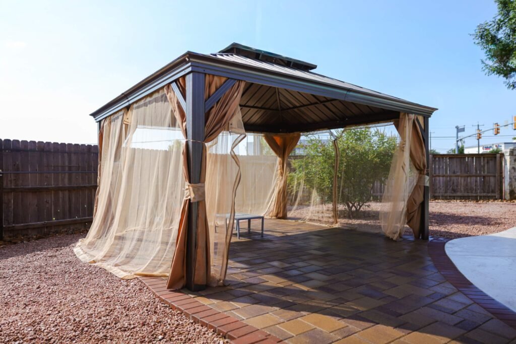 down-net_http20260317-312-m3tehq Outdoor patio with draped curtains