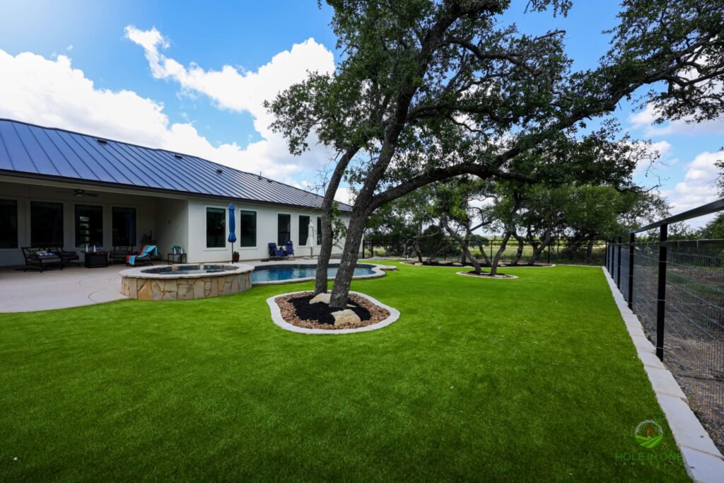 Synthetic grass lawn with trees