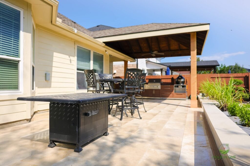 Backyard patio with pergola and outdoor kitchen