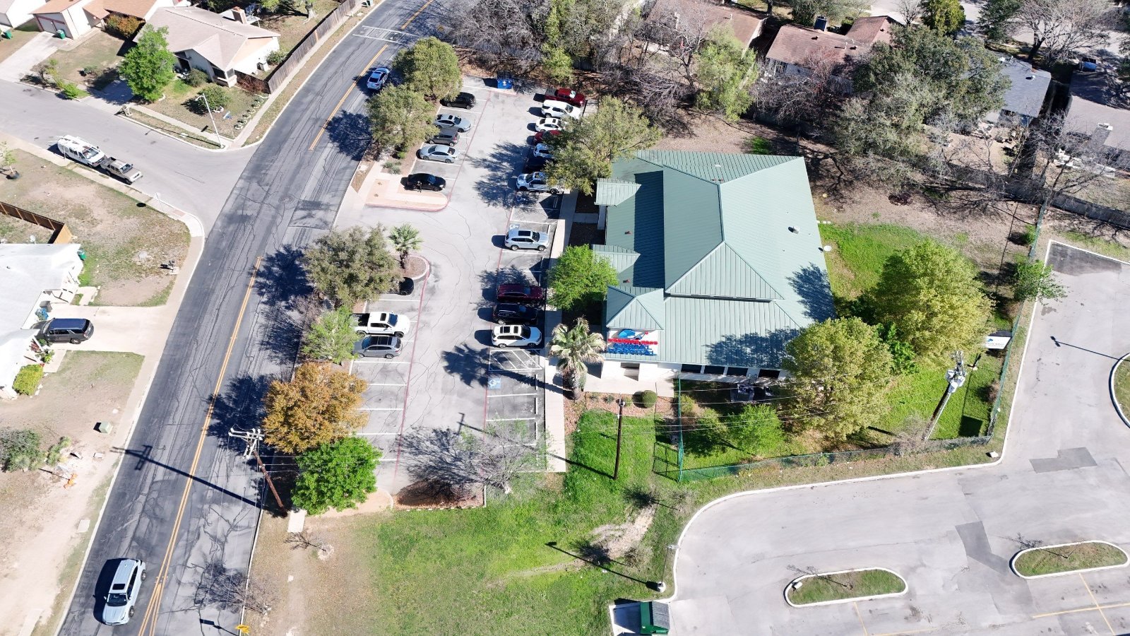 Aerial view of a commercial property in San Antonio maintained by Hole In One Lawns
