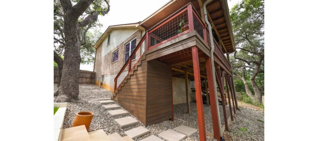 Elevated Trex deck and stairs with privacy skirting on a sloped San Antonio lot