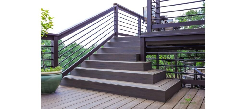 Trex composite stairs with horizontal metal railing leading to a second-story deck