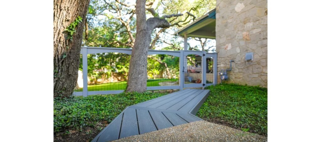 Trex composite deck platform with picture-frame border set into artificial turf